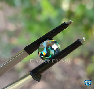 2 carat moissanite displayed in round rose cut style, featuring green moissanite tones and brilliant shape.
