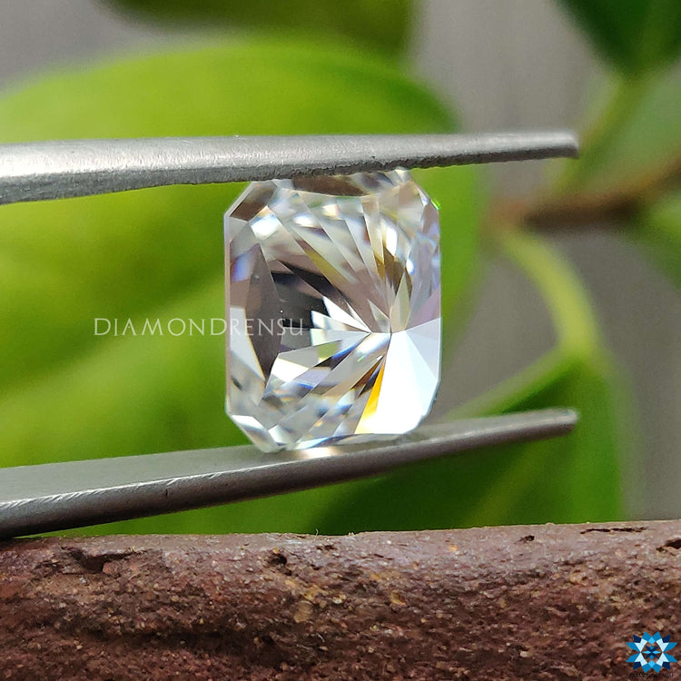 Loose Moissanite stone in Radiant Cut designed for a statement wedding band with Moissanite Radiant Cut detail.
