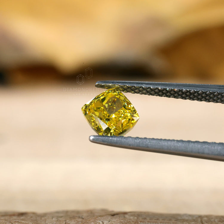 Loose lab grown diamond cushion cut yellow.
