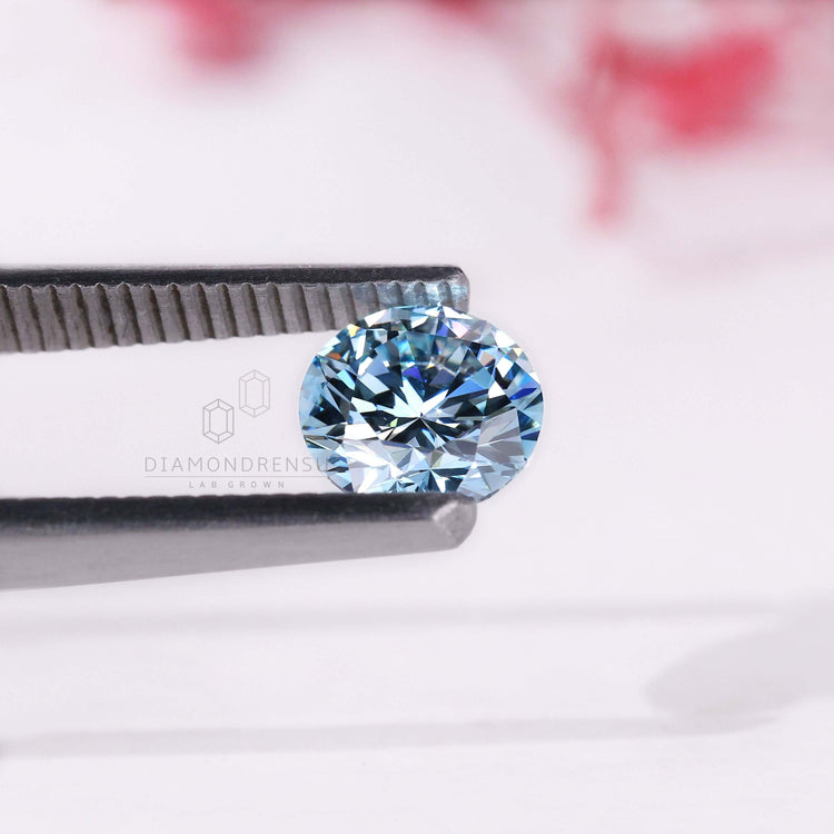 A fancy blue diamond, IGI certified and lab grown, shown as a loose diamond.