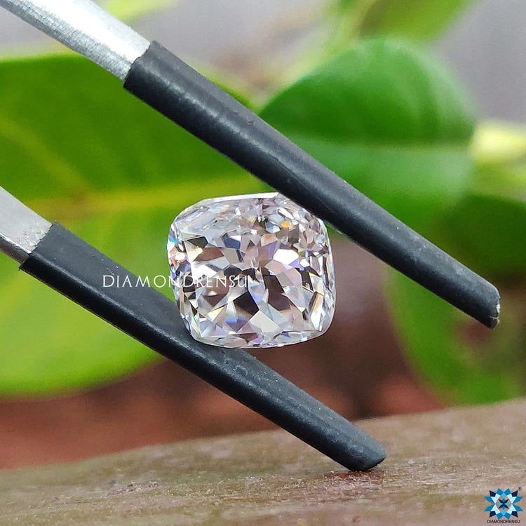 Cushion cut moissanite loose stone shown for custom designs.
