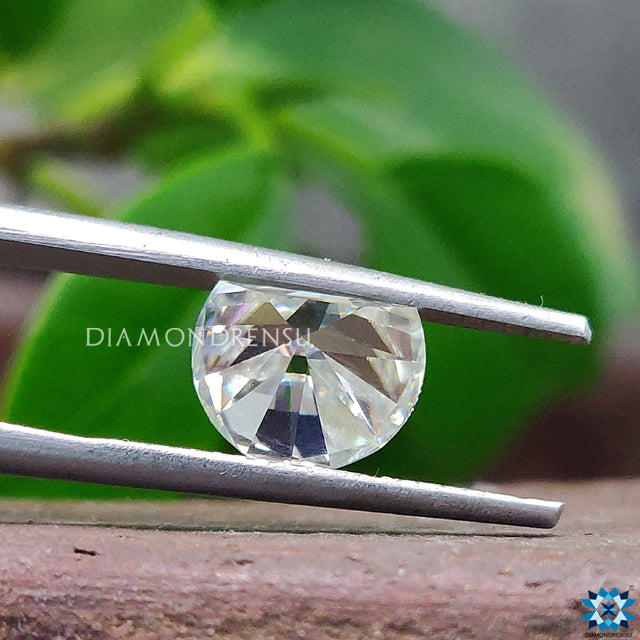 Half moon moissanite listed as 1.90 carat moissanite in off white tone.
