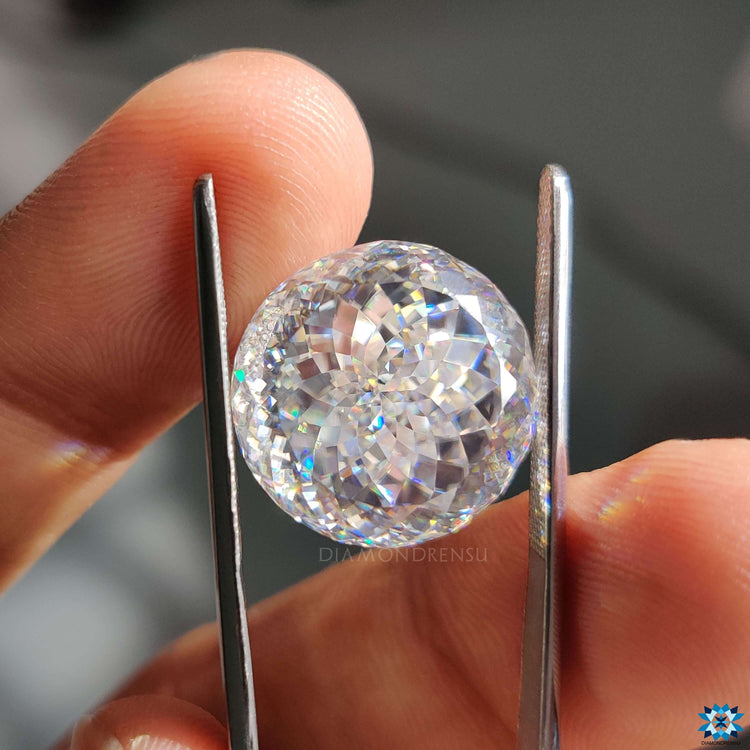 Antique portuguese cut moissanite rests near loose moissanite stone.
