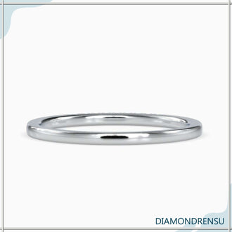 Lab grown diamondrensu wedding band featuring a half eternity band design.
