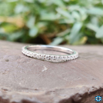 Beautiful eternity ring round set with round-cut moissanite stones for a sophisticated look.