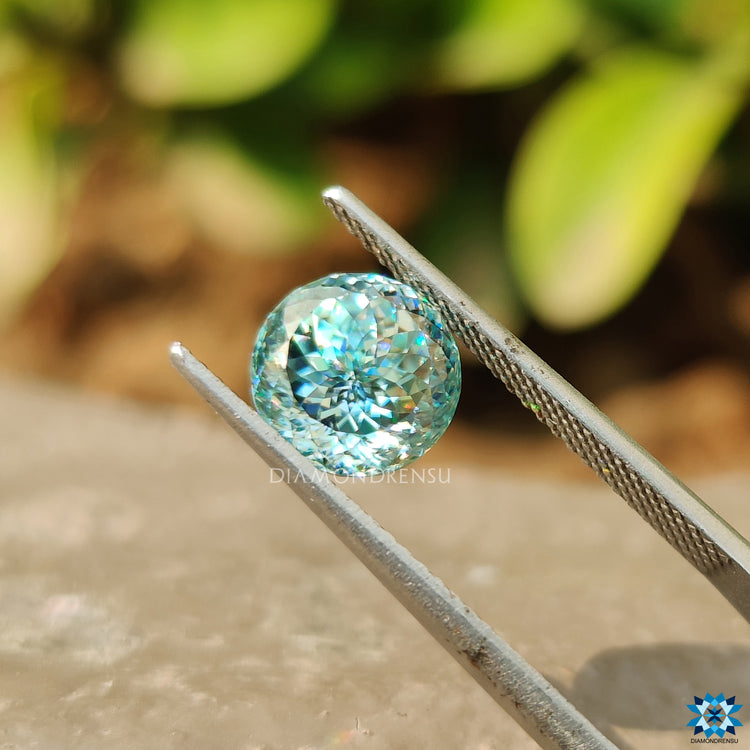 2.09 carat cyan blue Portuguese cut displayed as a single moissanite.
