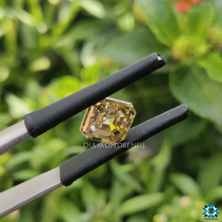 Loose stone featuring Champagne Moissanite in Asscher Cut style.
