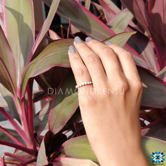 Moissanite half eternity band for subtle sophistication.