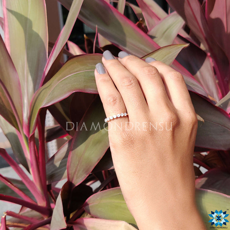 Moissanite half eternity band for subtle sophistication.
