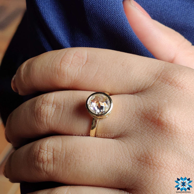 Handmade ring featuring a beautifully set round moissanite.