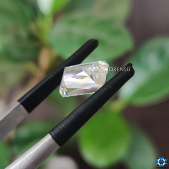 3.05 carat moissanite next to moissanite loose stone.