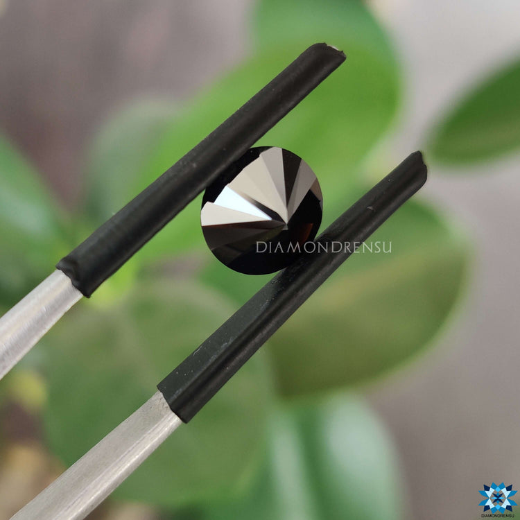 Moissanite round brilliant cut shining on moissanite loose stone.
