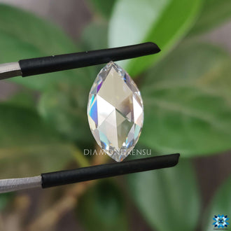 Rose cut marquise moissanite next to moissanite antique cut.
