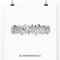 Full round wedding band featuring round cut diamonds in a 2 prong setting.
