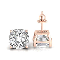 Elegant cushion cut diamond stud earrings with a 4 prong setting for secure wear.
