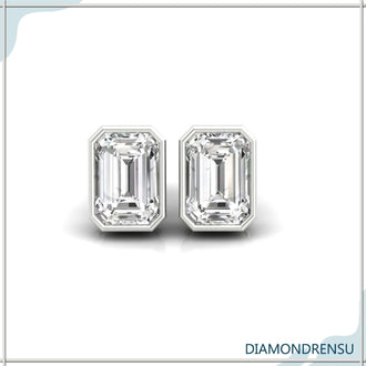 Bezel set earrings with emerald cut diamonds, perfect for adding a touch of sophistication.
