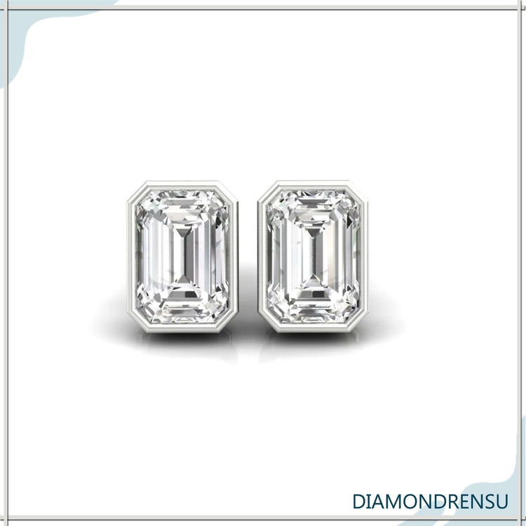 Bezel set earrings with emerald cut diamonds, perfect for adding a touch of sophistication.
