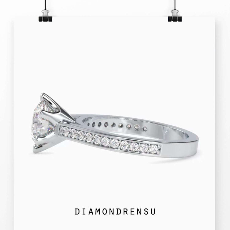 Channel set engagement ring featuring a six prong round engagement ring design.