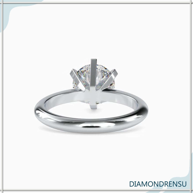 Handmade jewelry featuring a round diamond ring in solitaire setting

