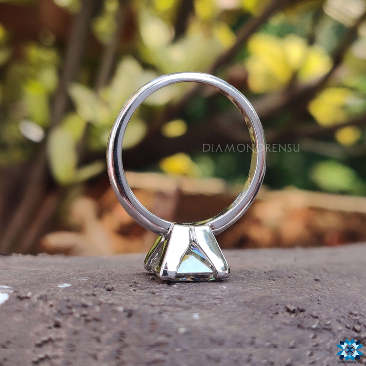 Gold solitaire engagement ring featuring a V prong setting for enhanced elegance and durability.