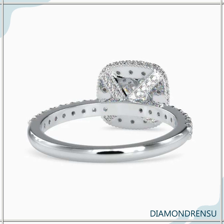 Diamondrensu engagement ring with a cushion cut halo and a pave ring setting for added brilliance.