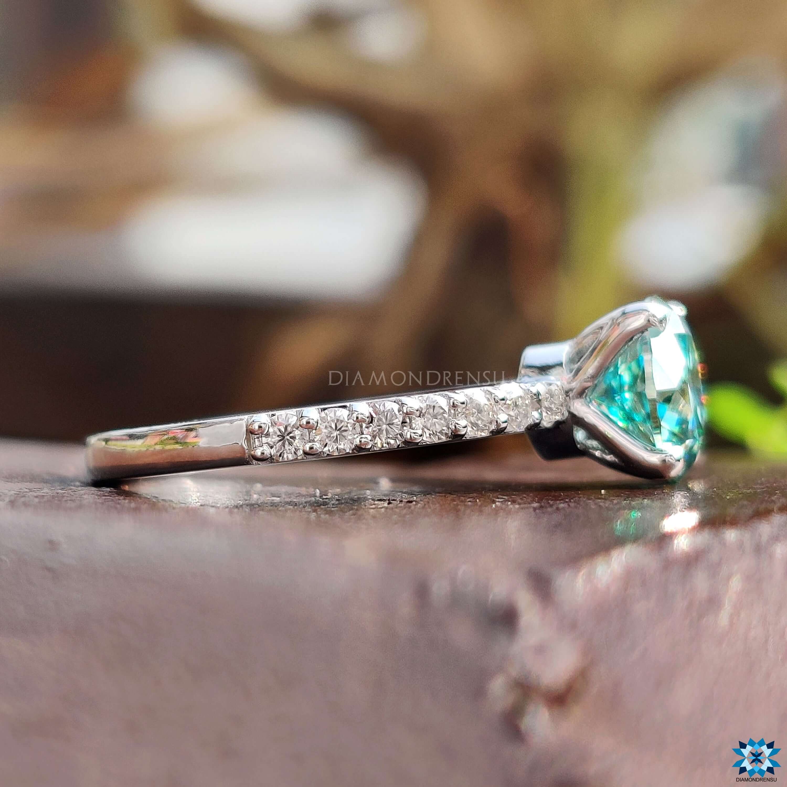 cyan blue moissanite engagement ring