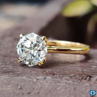 Gold solitaire engagement ring crafted to offer both elegance and durability.
