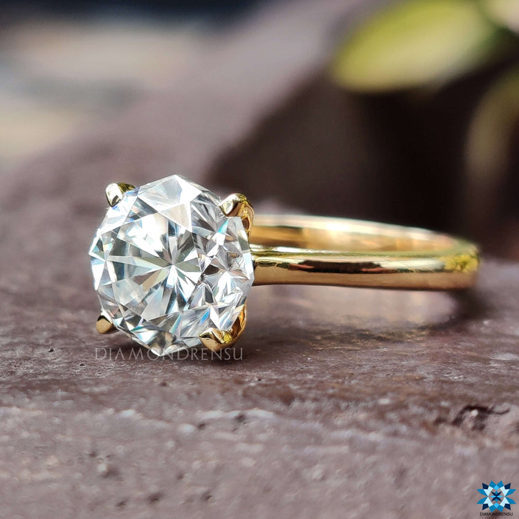 Gold solitaire engagement ring crafted to offer both elegance and durability.
