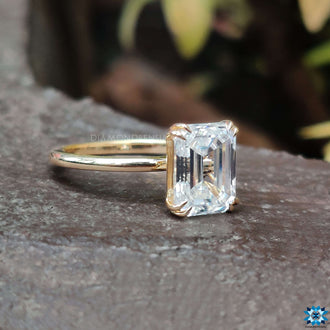 Emerald cut engagement ring with sleek lines and a bold, classic design.
