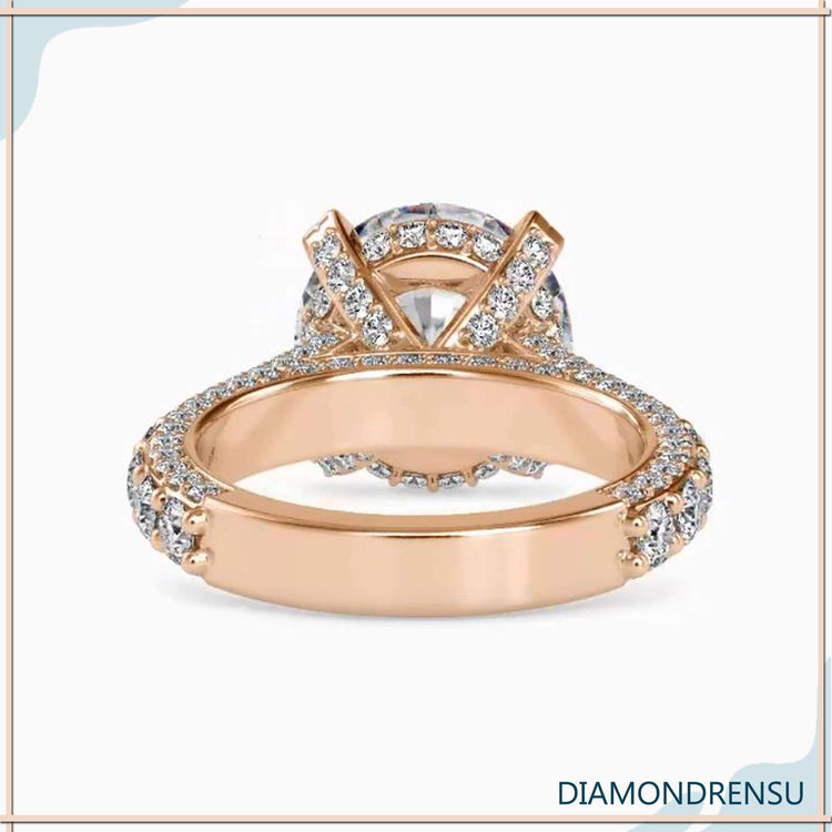 Pave diamond ring band with side stone engagement accents.
