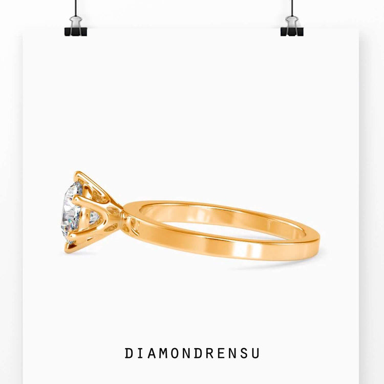 Solitaire engagement diamond ring featuring a round cut ring and a 6 prong setting for security.