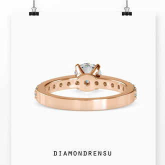 Shared prong setting for round diamond pave ring.