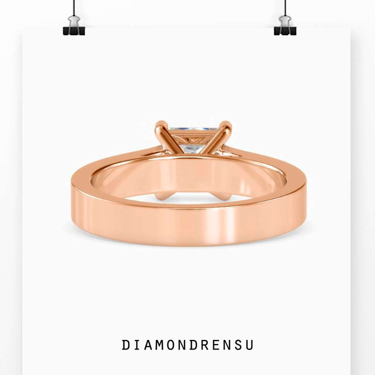 Channel set diamond engagement ring in yellow gold with princess cut
