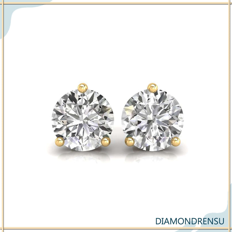 Beautiful 3 prong diamond earrings in a martini setting, crafted with handmade jewelry.
