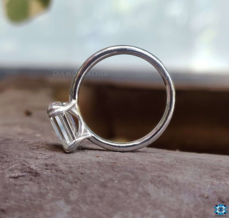 Engagement moissanite ring with a solitaire emerald cut for a classic look.
