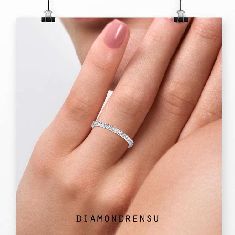 Round cut diamond half eternity wedding band in a shared prong setting.
