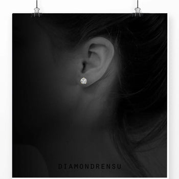 Classic diamond earring in a martini setting, ideal for a minimalist look.
