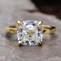 A stunning cushion cut ring with a classic design, perfect for timeless elegance.