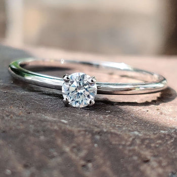 A stunning round engagement ring with a classic design.
