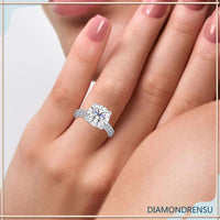 Cathedral ring setting featuring a pave prong engagement ring design.
