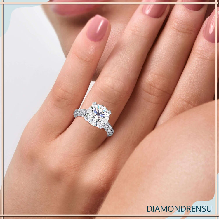 Cathedral ring setting featuring a pave prong engagement ring design.
