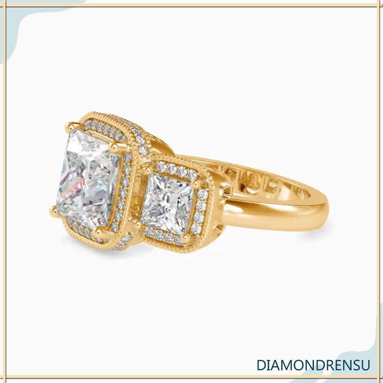 Filigree engagement ring with a princess cut diamond and side stones