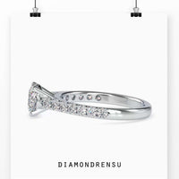 Exquisite cathedral setting ring featuring a round diamond and a prong setting.
