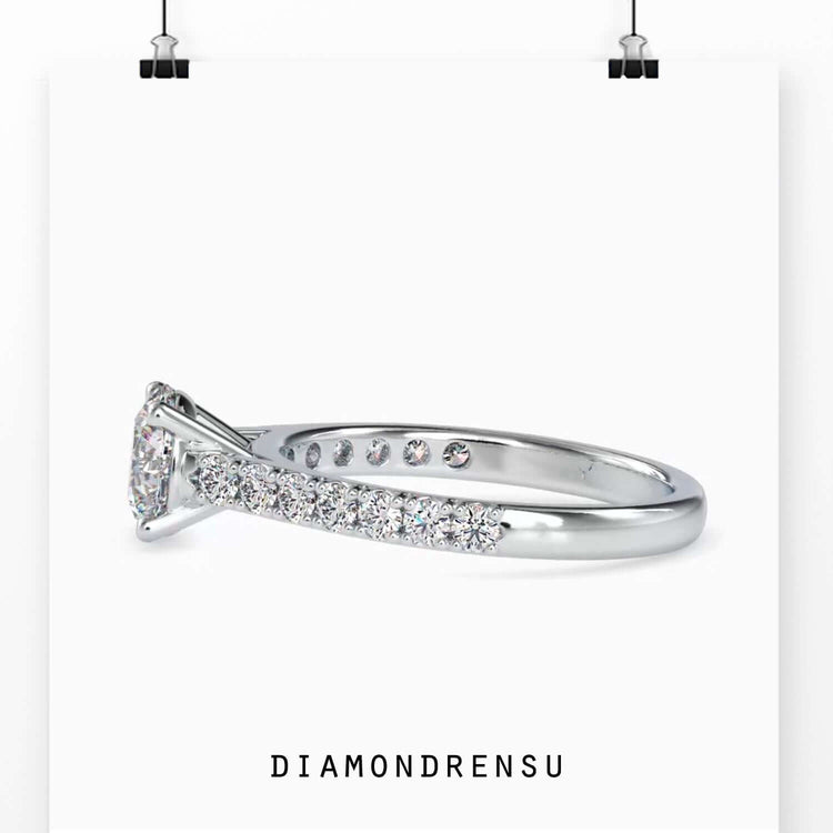 Exquisite cathedral setting ring featuring a round diamond and a prong setting.
