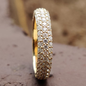 Pave wedding band featuring intricate and elegant design.