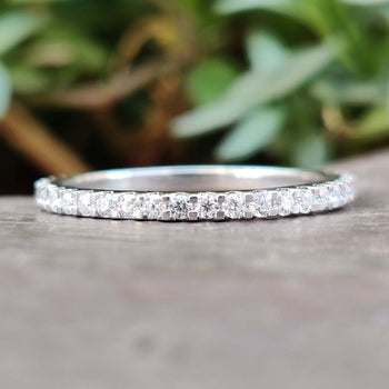 Elegant moissanite eternity band with sparkling stones, perfect for a timeless look.