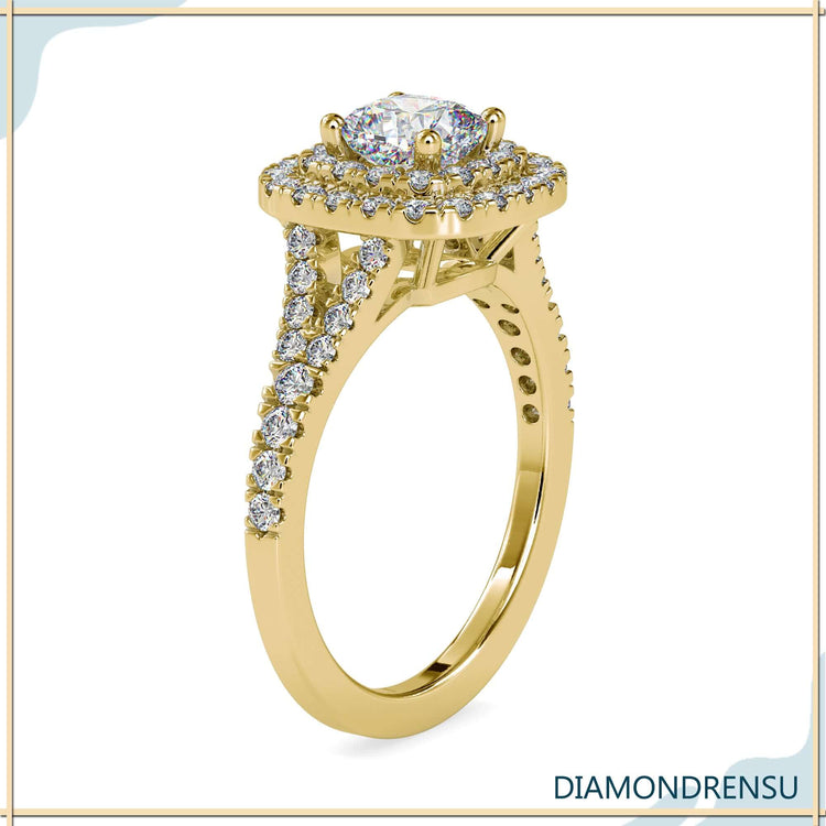 Handmade split shank diamond engagement ring with a 2 carat cushion cut and pave setting.