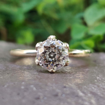 A stunning antique moissanite ring set in a timeless design, perfect for vintage jewellery enthusiasts.
