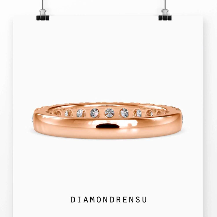 Ladies gold wedding band with a diamond half eternity band for classic elegance.
