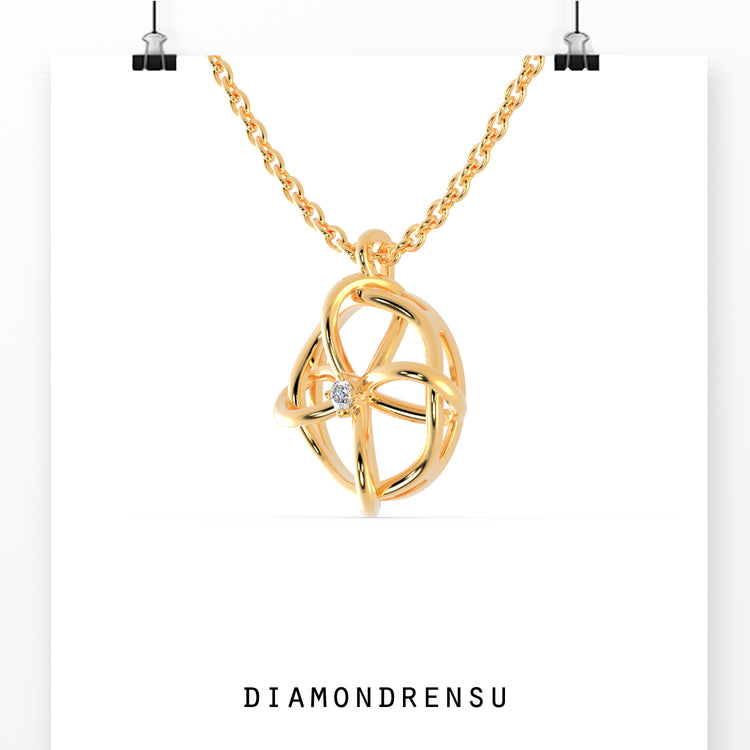 The gold pendant adds a warm, classic touch to any outfit.
